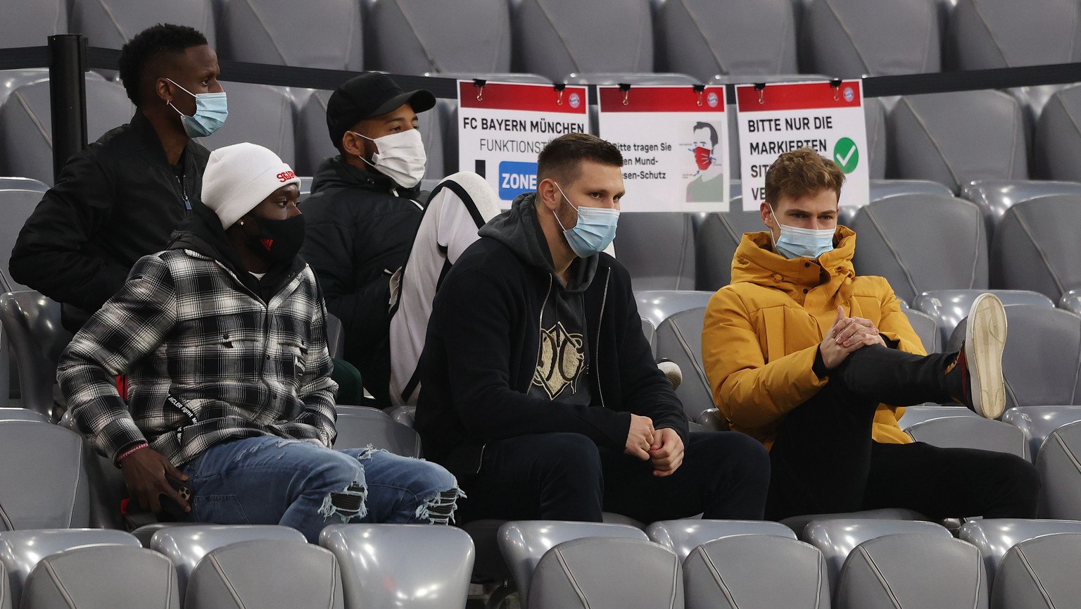 epa08835143 (L-R front Row) Alphonso Davies, Niklas Suele and Joshua Kimmich of Bayern Munich attend the German Bundesliga soccer match between FC Bayern Munich and SV Werder Bremen at Allianz Arena i ...