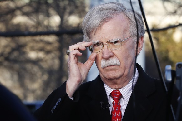 FILE - In this March 5, 2019, file photo, U.S. national security adviser John Bolton adjusts his glasses before an interview at the White House in Washington. North Korea has issued a relatively mild  ...