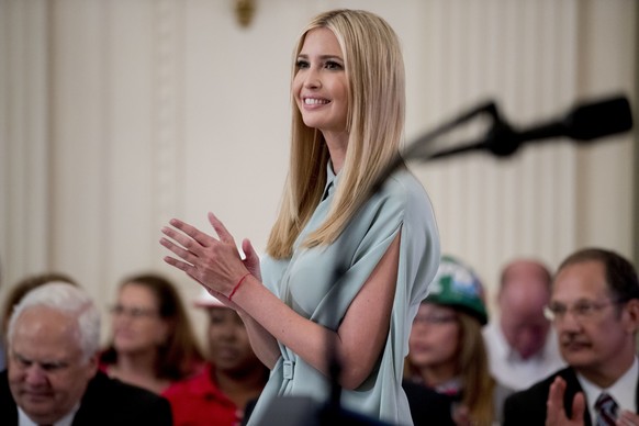 FILE - In a Thursday, July 19, 2018 file photo, Ivanka Trump, the daughter of President Donald Trump, applauds during a signing ceremony where President Donald Trump signed an Executive Order that est ...