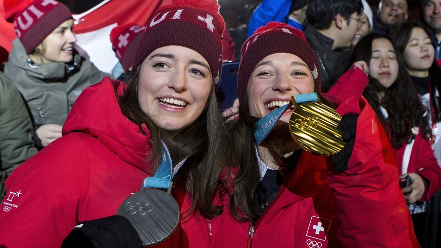 Silver medal winner Mathilde Gremaud of Switzerland, left, and Gold medal winner Sarah Hoefflin of Switzerland, right, celebrate at the House of Switzerland after the women Freestyle Skiing Slopestyle ...