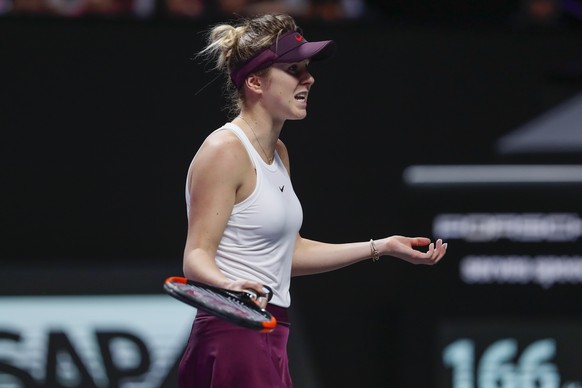 Elina Svitolina of Ukraine reacts as she plays against Belinda Bencic of Switzerland during the WTA Finals Tennis Tournament at the Shenzhen Bay Sports Center in Shenzhen, China&#039;s Guangdong provi ...