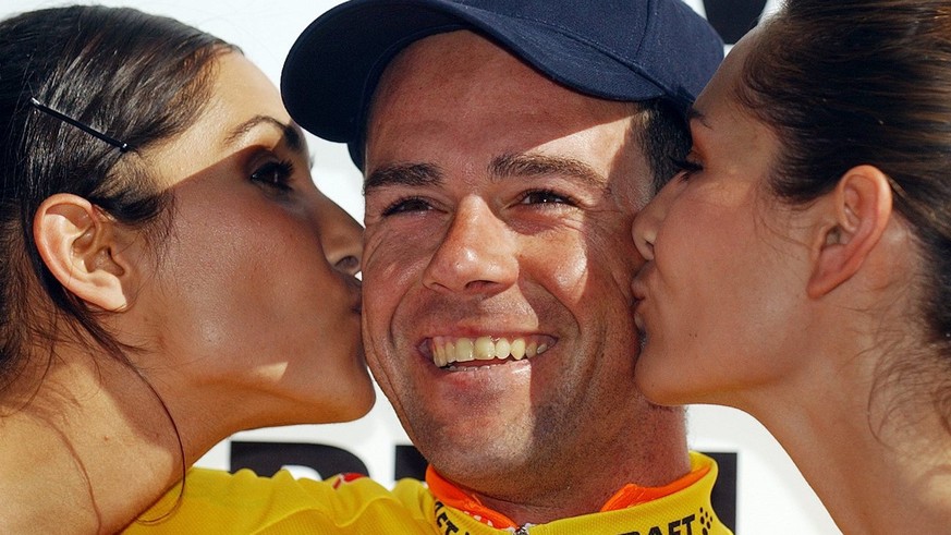 Aitor Gonzalez of Spain is being kissed on the podium in Ulrichen after winning the Tour de Suisse cycling race, Sunday, June 19, 2005. The last stage was a round trip from Ulrichen to Ulrichen. (KEYS ...