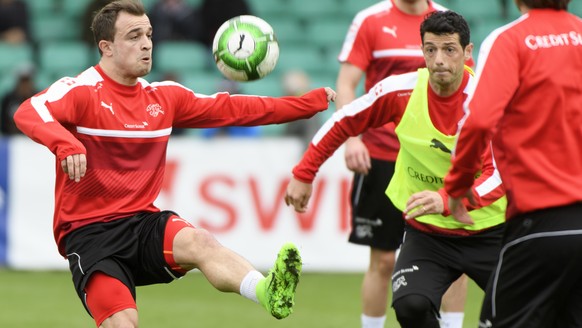 Swiss midfielder Blerim Dzemaili, right, and Swiss forward Xherdan Shaqiri, left, attend a practice session of the Swiss squad in Lausanne, Switzerland, Tuesday, March 21, 2017. Switzerland will play  ...