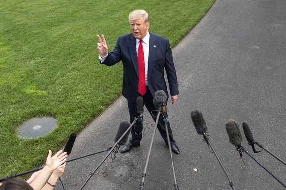 epa07656731 US President Donald J. Trump speaks to the media as he departs the White House for a campaign event in Florida in Washington, DC, USA, 18 June 2019. President Trump is travelling to Orland ...