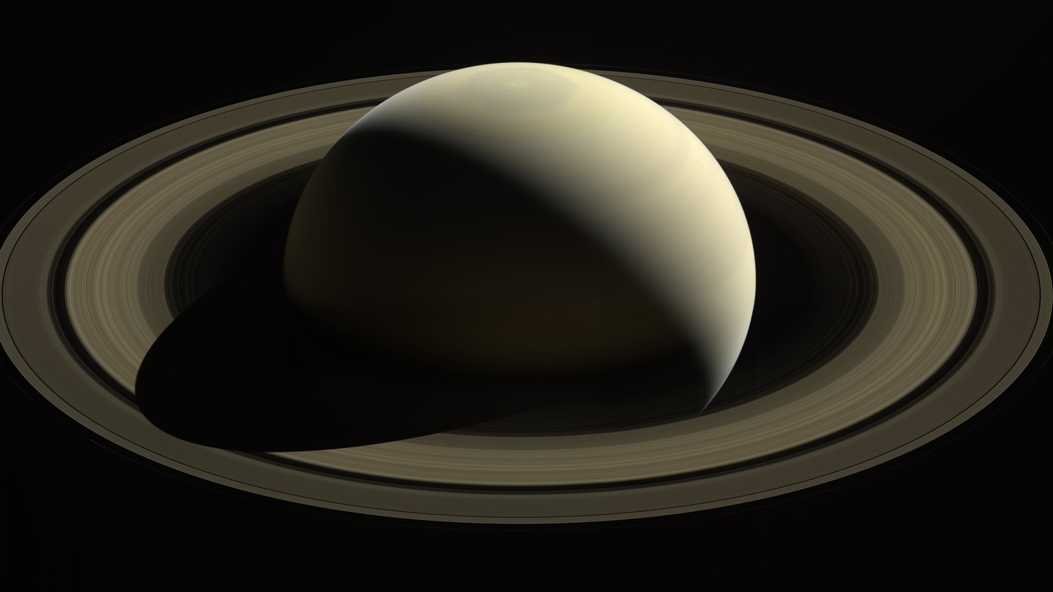epa06199149 A handout photo made available by NASA on 12 September 2017 shows an image captured by the Cassini spacecraft of one of its last looks at Saturn and its main rings from a distance of appro ...