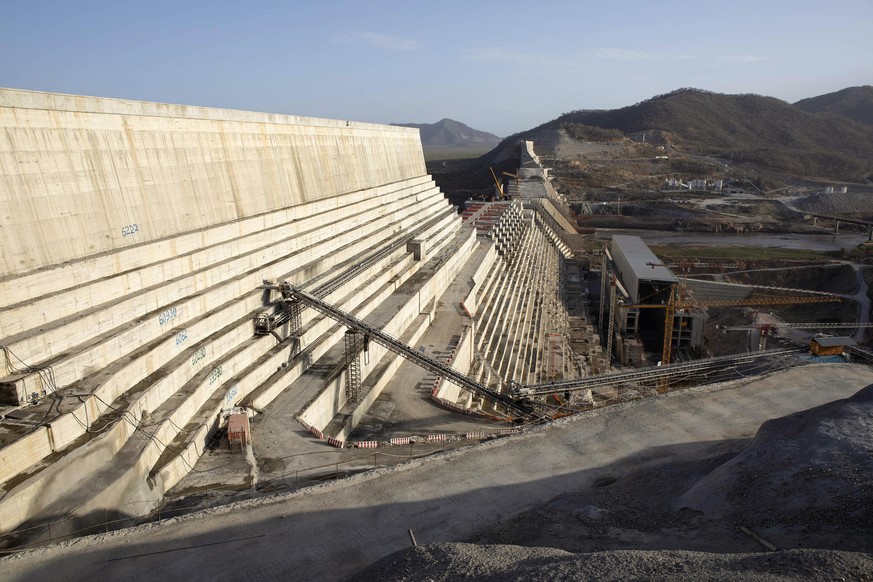 Construction machinery stands on the side of the dam wall at the site of the under-construction Grand Ethiopian Renaissance Dam in the Benishangul-Gumuz Region of Ethiopia, on Tuesday, May 21, 2019. D ...