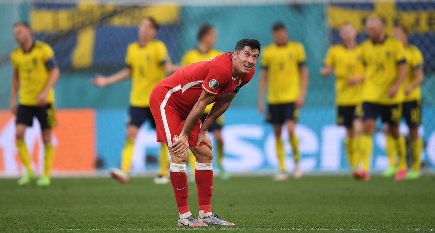 epa09296355 Robert Lewandowski of Poland reacts after losing the UEFA EURO 2020 group E preliminary round soccer match between Sweden and Poland in St.Petersburg, Russia, 23 June 2021. EPA/Kirill Kudr ...