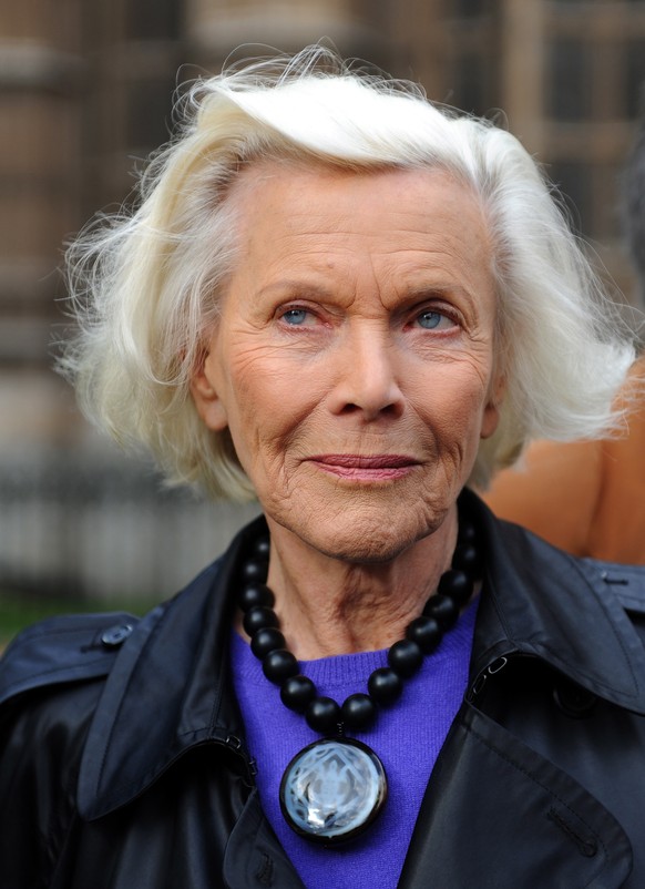 epa08346422 (FILE) - Former Bond girl Honor Blackman is pictured during a protest with pensioners outside parliament in London, Britain, 04 November 2009 (reissued on 06 April 2020). On 06 April 2020  ...