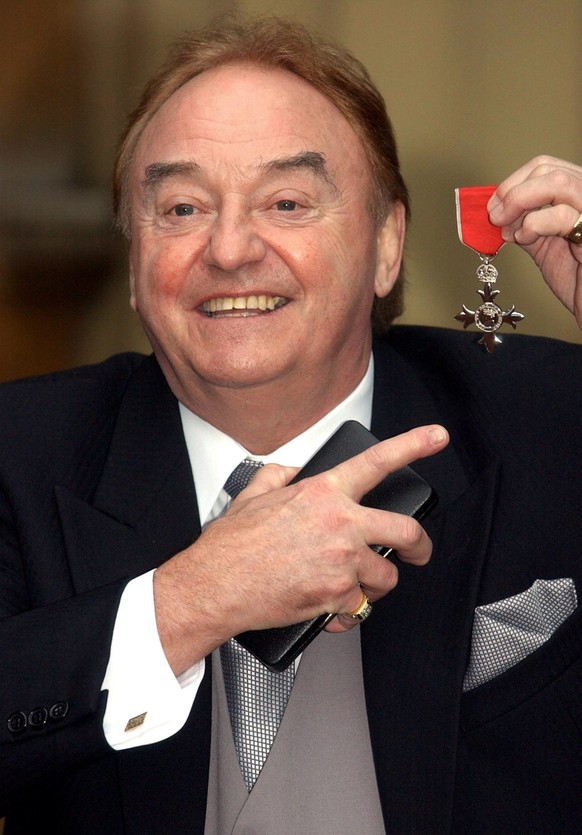Sixties singing sensation Gerry Marsden, from Liverpool, with his MBE for services to Liverpudlian Charities at Buckingham Palace, London, Friday December 12 2003. The Prince said it was nice to see t ...