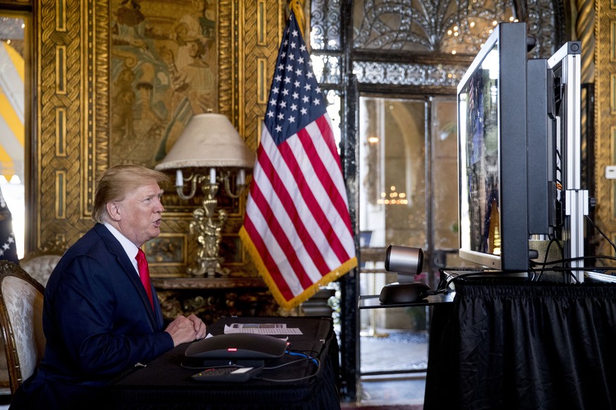 President Donald Trump speaks during a Christmas Eve video teleconference with members of the military at his Mar-a-Lago estate in Palm Beach, Fla., Tuesday, Dec. 24, 2019. (AP Photo/Andrew Harnik)
Do ...