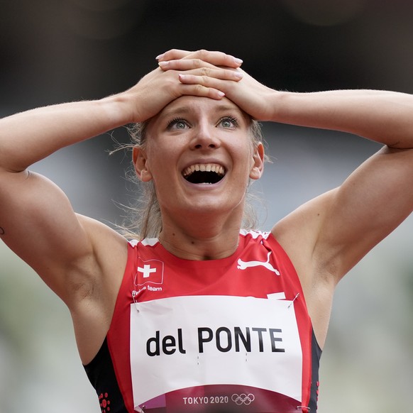 Ajla Del Ponte, of Switzerland, reacts after a heat in the women&#039;s 100-meter run at the 2020 Summer Olympics, Friday, July 30, 2021, in Tokyo. (AP Photo/Martin Meissner)