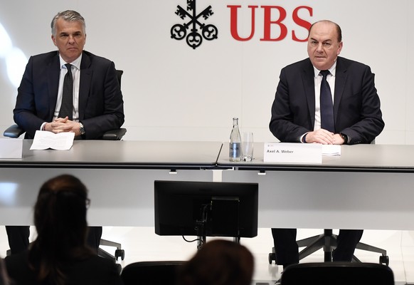 epa08230376 (L-R) Sergio Ermotti, CEO of Swiss Bank UBS, Axel Weber, Chairman of the Board of Directors of UBS and Ralph Hamers, future CEO of Swiss Bank UBS, during a press conference in Zurich, Swit ...