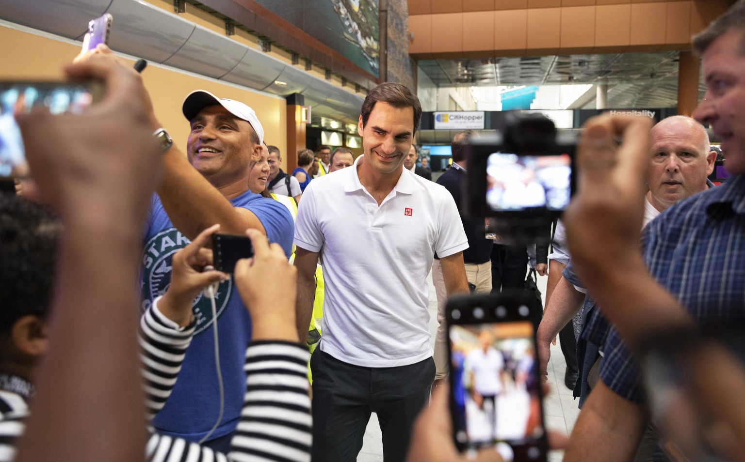 epa08195114 Roger Federer (C) of Switzerland arrives at Cape Town International Airport, South Africa, 05 February 2020. Roger Federer will play Rafael Nadal in the Match in Africa Cape Town charity e ...