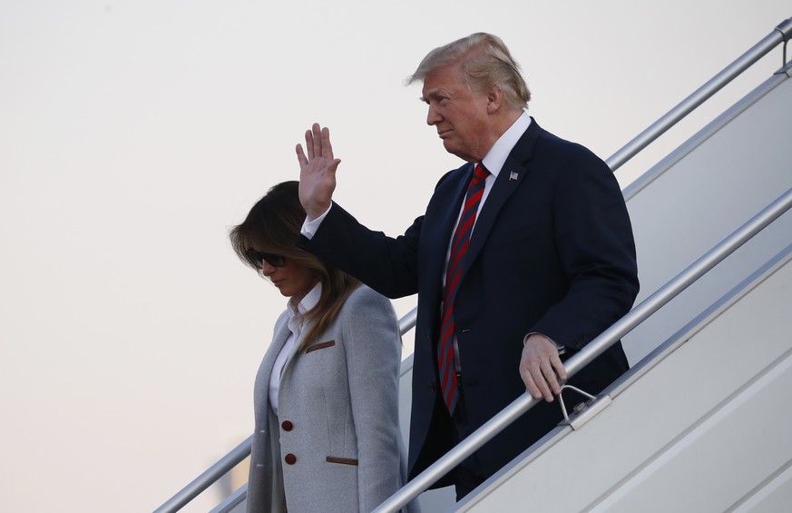 U.S. President Donald Trump, right, waves as he and his wife Melania arrive at the airport in Helsinki, Finland, Sunday, July 15, 2018 on the eve of his meeting with Russian President Vladimir Putin.  ...
