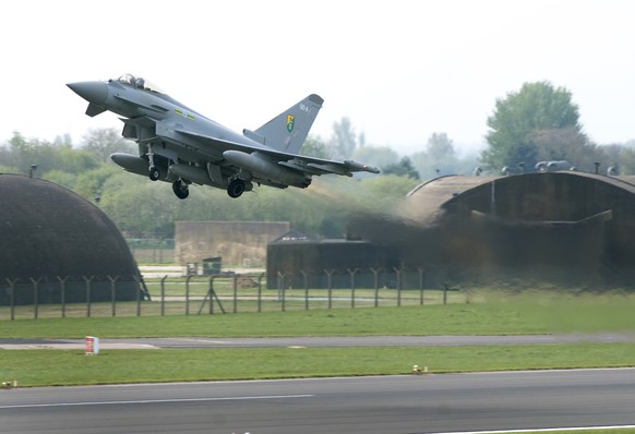 In this photo released by Britain&#039;s RAF, one of Britain&#039;s Royal Air Force Typhoon aircraft lifts off from an RAF base near Lincoln, England, Monday April 28, 2014, deployed to take part in t ...