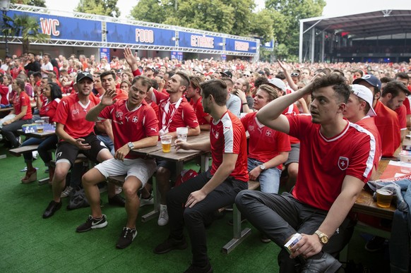 Swiss supporters react at a public viewing of the FIFA 2018 World Cup round of 16 soccer match between Switzerland and Sweden, in the fan zone &quot;Winti Arena&quot; in Winterthur, Switzerland, Tuesd ...