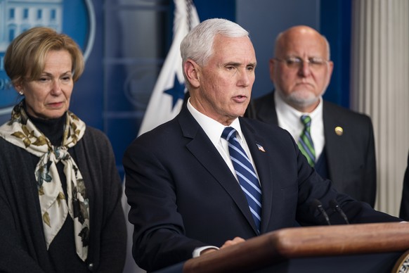 epa08270655 US Vice President Mike Pence, surrounded by members of President Trump?s Coronavirus Task Force, speaks to the media about the coronavirus in the Press Briefing Room of the White House in  ...