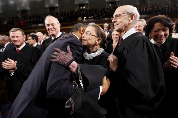 FILE - In this Jan. 25, 2011, file photo, President Barack Obama hugs Supreme Court Justice Ruth Bader Ginsburg on Capitol Hill in Washington, prior to delivering his State of the Union address. From  ...