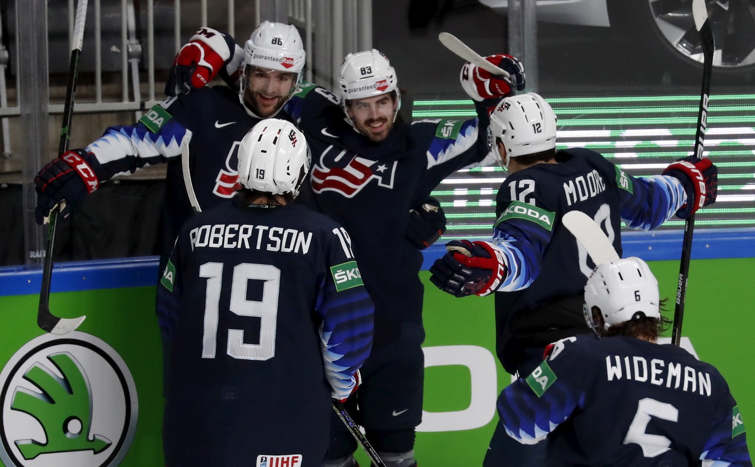 epa09250851 Players of USA celebrate a goal during the IIHF 2021 World Ice Hockey Championships bronze medal match between USA and Germany at the Arena Riga, Latvia, 06 June 2021. EPA/TOMS KALNINS
