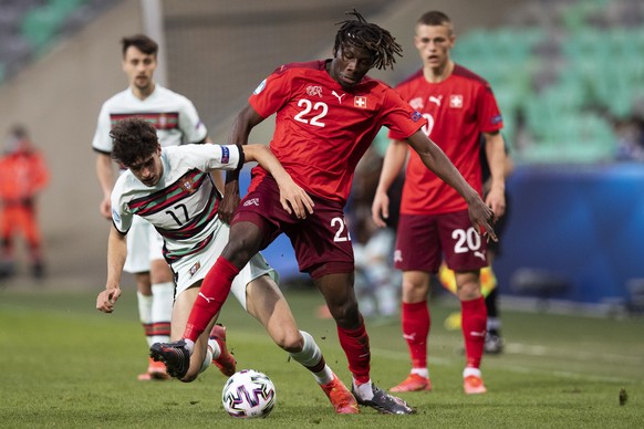 epa09108847 Portugal&#039;s Francisco Trincao (L) in action against Switzerland&#039;s Alexandre Jankewitz (C) during the UEFA European Under-21 Championship group D soccer match between Switzerland a ...