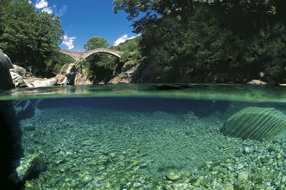 scuba diver in a freshwater river, Verzasca valley, Ticino, Switzerland