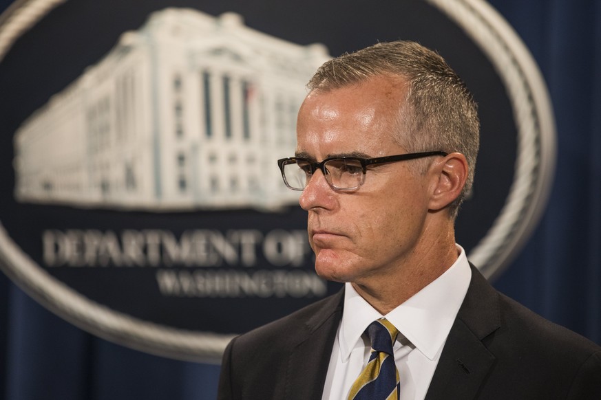 epa06484280 (FILE) Acting FBI Director Andrew McCabe, waits to speak at a press conference to announce the results from the Justice Department&#039;s annual national health care fraud takedown at the  ...