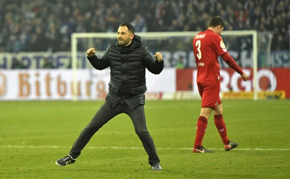 Schalke&#039;s head coach Domenico Tedesco celebrates after winning the German soccer cup match between FC Schalke 04 and 1. FC Cologne in Gelsenkirchen, Germany, Tuesday, Dec. 19, 2017. (AP Photo/Mar ...