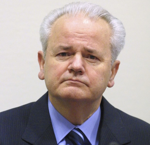FILE - In this Jan. 9, 2002 file photo, former Yugoslav President Slobodan Milosevic sits down in a courtroom of the war crimes tribunal in The Hague, the Netherlands ahead of his pre-trial hearing. T ...