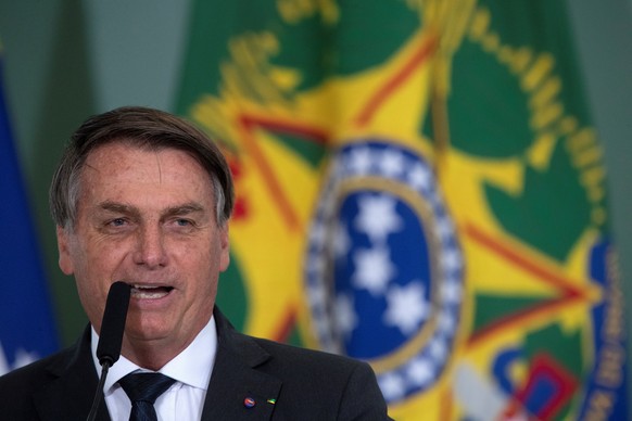 epa08624888 The President of Brazil Jair Bolsonaro participates in a launching ceremony of the Casa Verde e Amarela Program, at the Palacio do Planalto, in Brasilia, Brazil, 25 August 2020. Bolsonaro, ...
