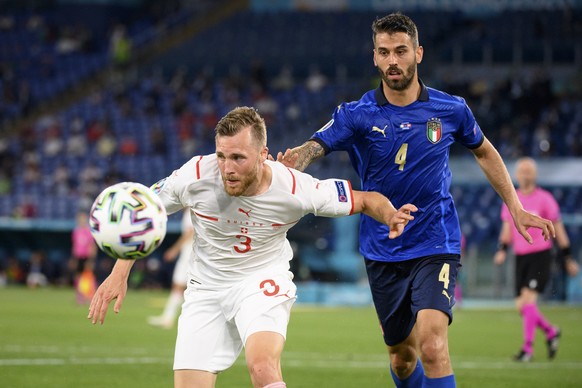 epa09278315 Switzerland&#039;s defender Silvan Widmer (L) in action against Italy&#039;s defender Leonardo Spinazzola during the UEFA EURO 2020 group A preliminary round soccer match between Italy and ...
