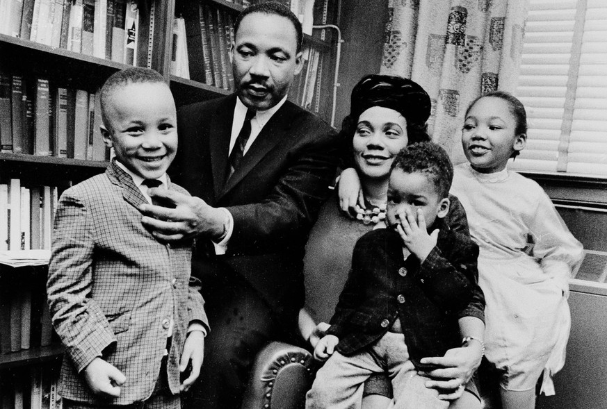 FILE - In this March 17, 1963, file photo, Dr. Martin Luther King Jr. and his wife, Coretta Scott King, sit with three of their four children in their Atlanta, Ga., home. From left are: Martin Luther  ...