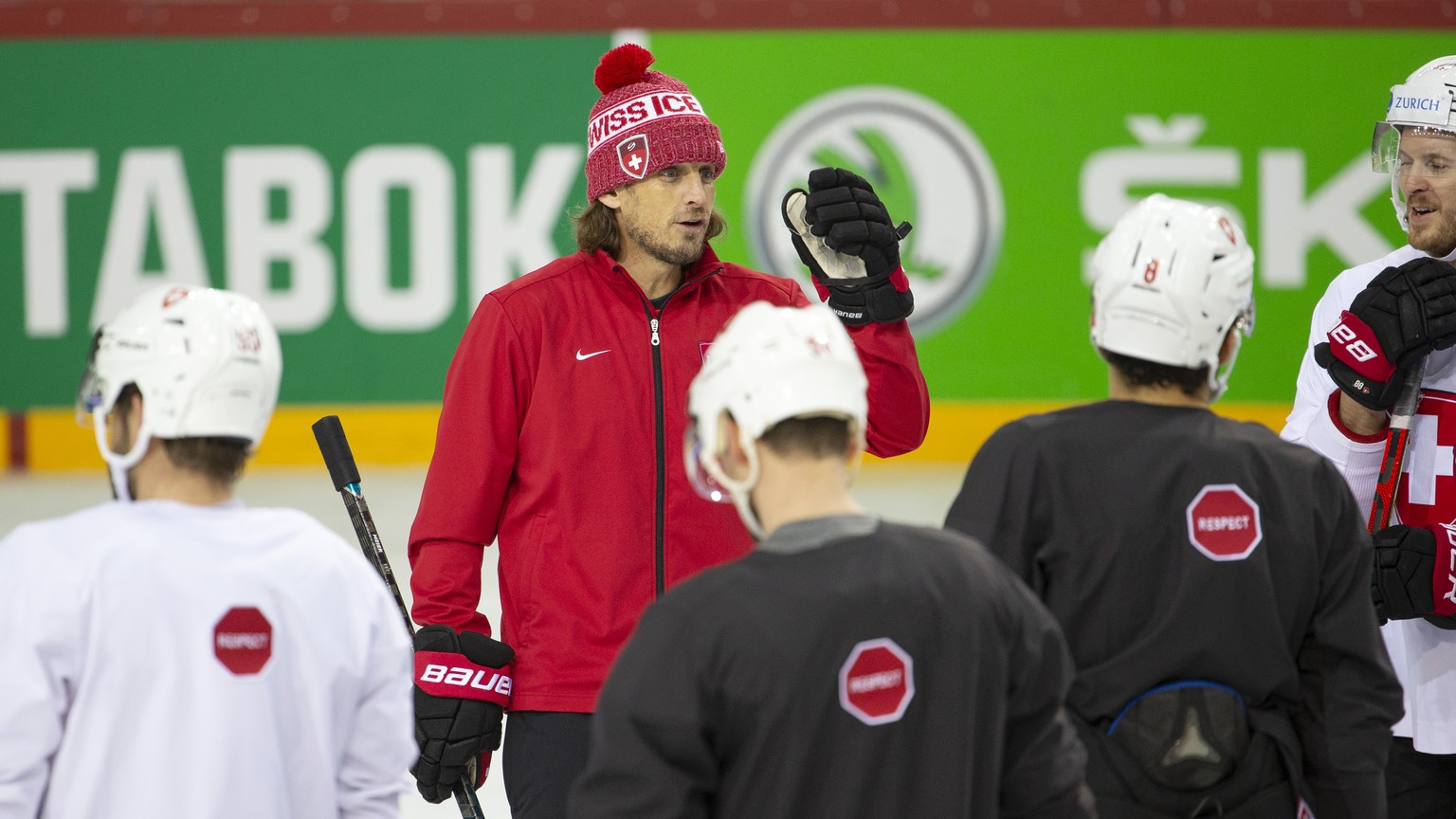 Patrick Fischer, head coach of Switzerland national ice hockey team, instructs his players during a training session, at the IIHF 2021 World Championship quarter final game between Switzerland and Ger ...