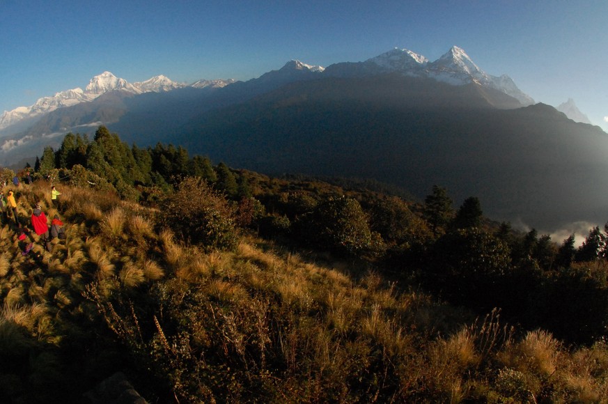 FILE - In this Friday, Oct. 24, 2014 file photo, trekkers watch the sun rise over the Annapurna Range, right, in central Nepal, as viewed from Poon Hill, above the village of Ghorepani. A Finnish clim ...