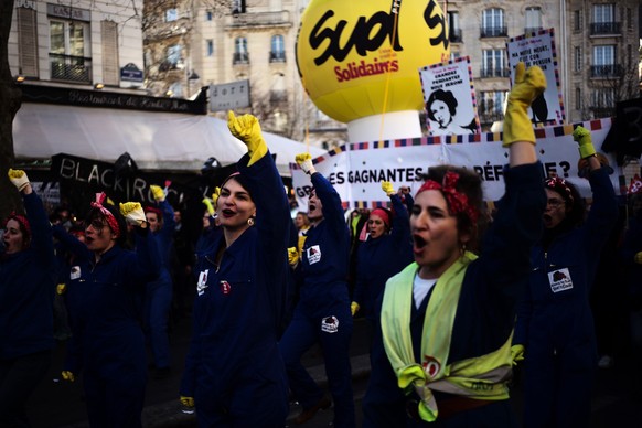 Women sing against French President Emmanuel Macron during a demonstration Thursday, Jan. 16, 2020 in Paris. Protesters are marching in the streets in Paris and other french cities in a new round of d ...
