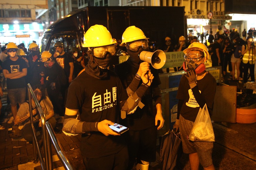 epa07754886 Anti-extradition bill protesters gather outside Tsim Sha Tsui police station during a rally in Hong Kong, China, 03 August 2019. Hong Kong is bracing itself for a ninth consecutive weekend ...