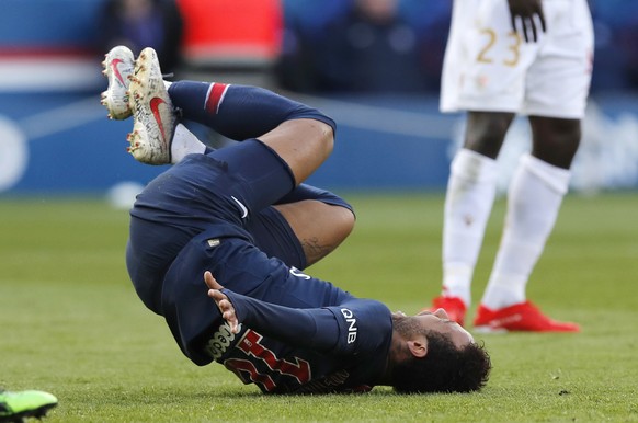 PSG&#039;s Neymar lies on the ground after falling during the French League One soccer match between Paris Saint-Germain and Nice at the Parc des Princes stadium in Paris, France, Saturday, May 4, 201 ...