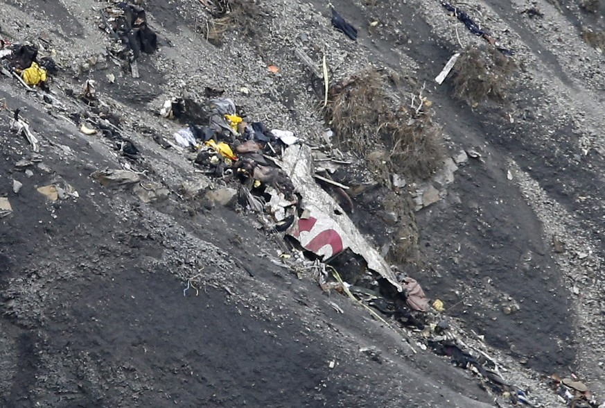epa05208961 (FILE) A file photograph showing debris as search and rescue workers are at the crash site of the Germanwings Airbus A320 that crashed in the French Alps, above the town of Seyne-les-Alpes ...