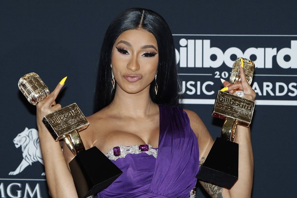 epaselect epa07541776 Cardi B poses with the awards for Top Rap Song &#039;I Like It&#039;, Top Hot 100 Song for &#039;Girls Like You&#039; and Top Rap Female Artist in the press room at the 2019 Bill ...