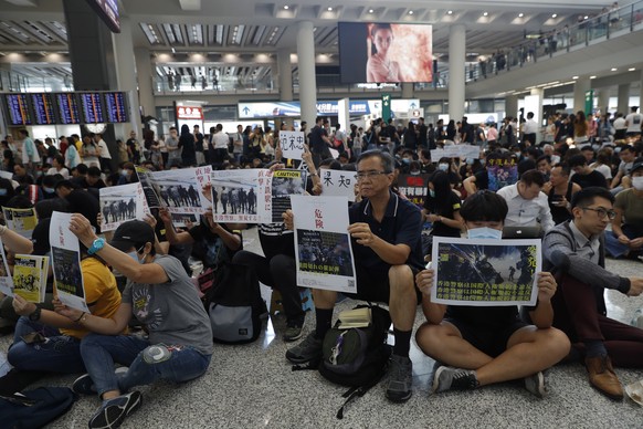 Protesters demonstrate at the airport in Hong Kong on Friday, Aug. 9, 2019. Pro-democracy protesters held a demonstration at Hong Kong&#039;s airport Friday even as the city sought to reassure visitor ...