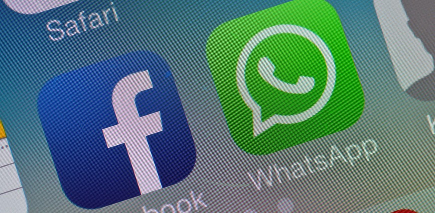 epa04090102 The two logos of Facebook (L) and Whatsapp pictured on the screen of a smartphone in Sieversdorf, Germany, 19 February 2014. Facebook announced on 19 February that it acquired the globally ...