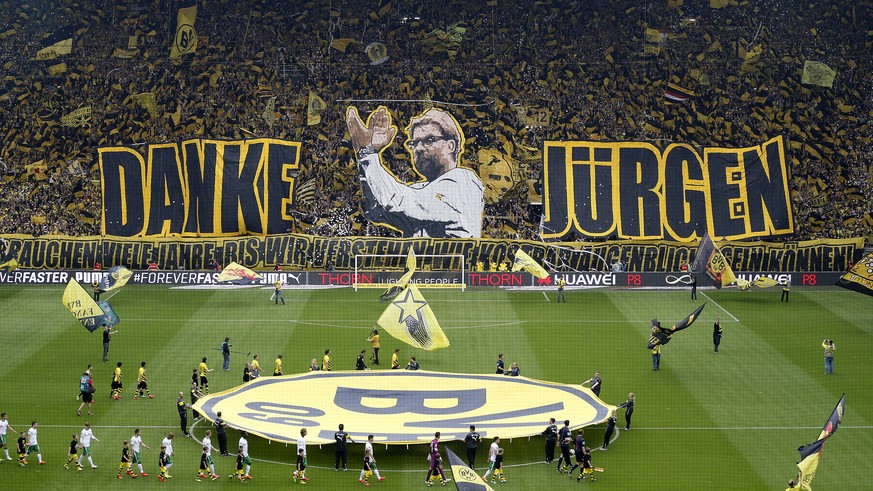 Dortmund supporters show banners to thank Dortmund&#039;s head coach Juergen Klopp prior to the German first division Bundesliga soccer match between BvB Borussia Dortmund and Werder Bremen in Dortmun ...