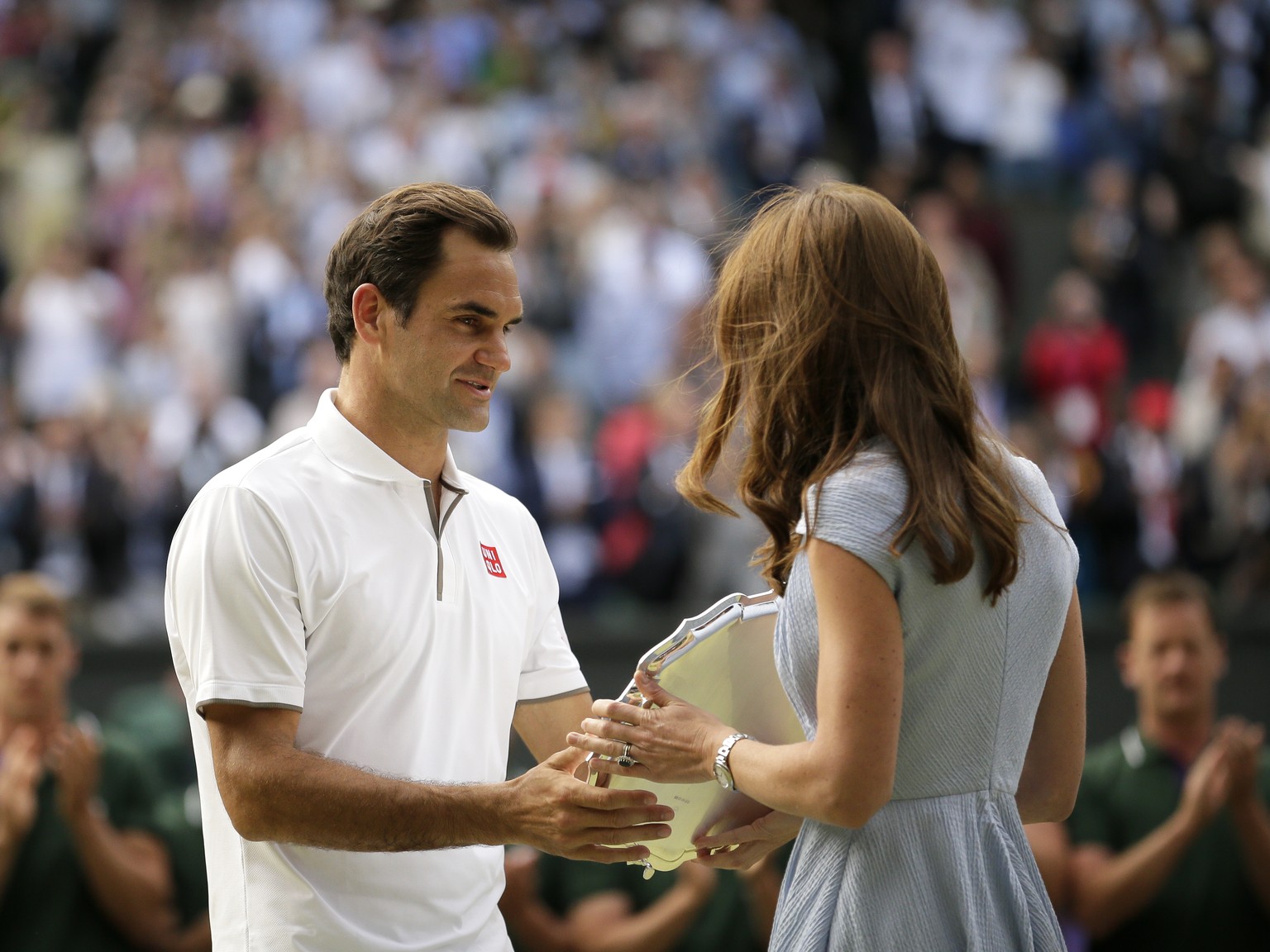 Switzerland&#039;s Roger Federer receives the runner up trophy from Kate, Duchess of Cambridge after losing to Serbia&#039;s Novak Djokovic in the men&#039;s singles final match of the Wimbledon Tenni ...