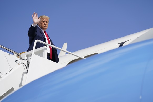 President Donald Trump waves as he boards Air Force One to travel to campaign rallies in Florida, Friday, Oct. 23, 2020, in Andrews Air Force Base, Md. (AP Photo/Evan Vucci)
Donald Trump