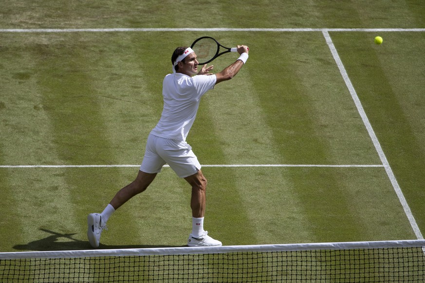 Roger Federer of Switzerland in action during his first round match against Lloyd Harris of South Africa, at the All England Lawn Tennis Championships in Wimbledon, London, on Tuesday, July 2, 2019.(K ...