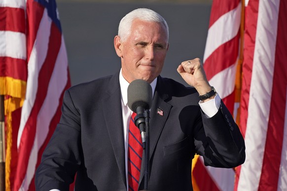 Vice President Mike Pence gestures as he speaks at a campaign rally at Allegheny County Airport in West Mifflin, Pa, Friday, Oct. 23, 2020. (AP Photo/Gene J. Puskar)