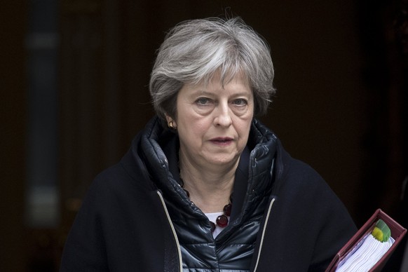 epaselect epa06603131 Britain&#039;s Prime Minister Theresa May leaves No. 10 Downing Street to attend the Prime Minister&#039;s Questions in the Houses of Commons, in London, Britain, 14 March 2018.  ...