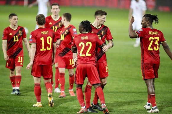 Belgium&#039;s Jeremy Doku, right, celebrates after scoring his side&#039;s fourth goal during a World Cup 2022 group E qualifying soccer match between Belgium and Belarus at the King Power stadium in ...