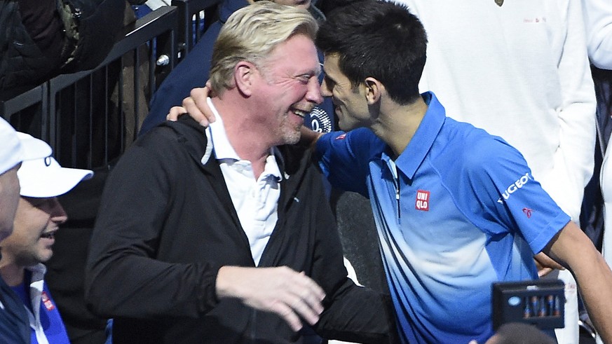 epa05663144 (FILE) A file picture dated 22 November 2015 shows Novak Djokovic of Serbia (R) hugs his coach Boris Becker (L) after winning against Roger Federer of Switzerland during the final at the A ...