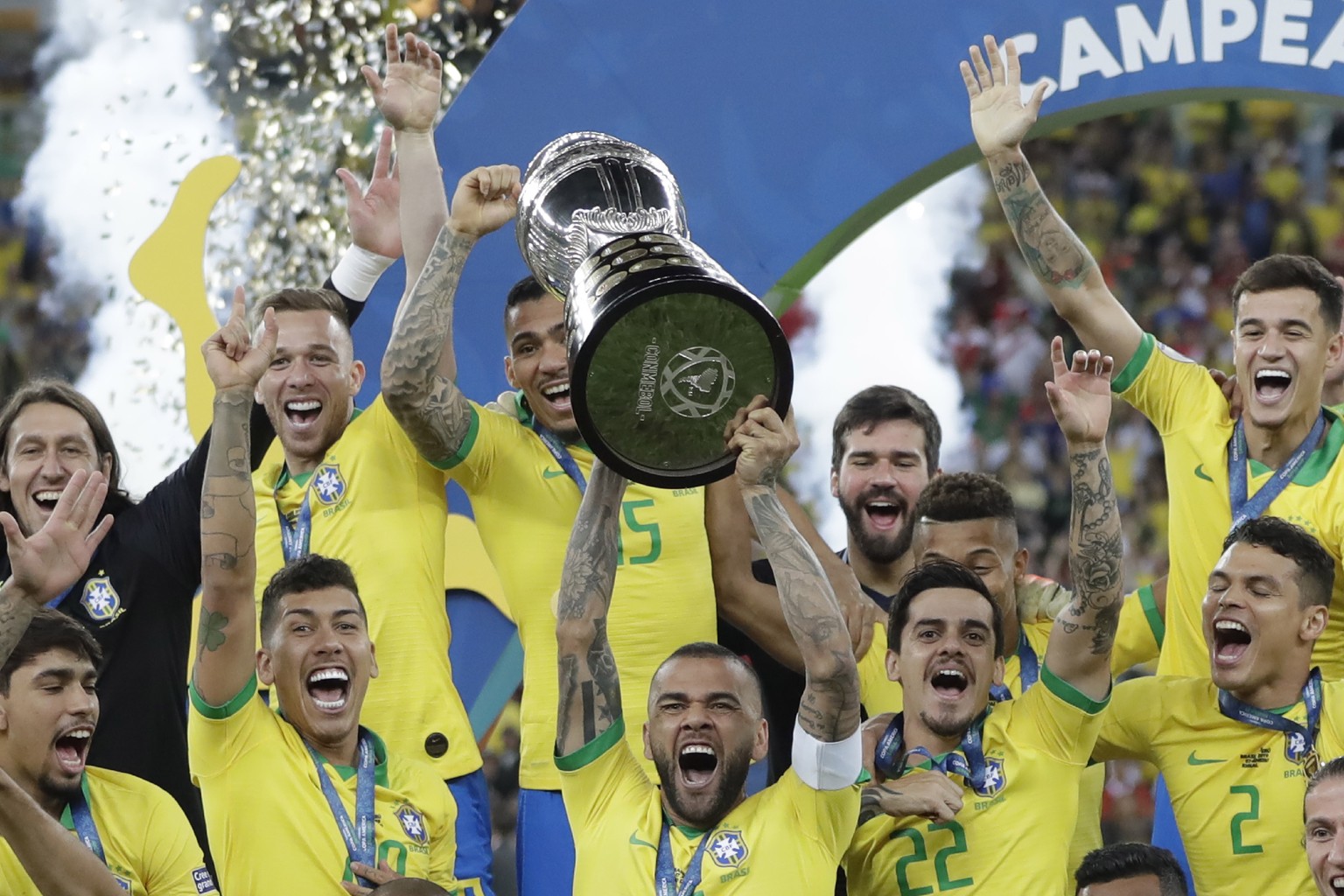 Brazil&#039;s Dani Alves lifts up his team&#039;s trophy after winning the final soccer match of the Copa America against Peru at Maracana stadium in Rio de Janeiro, Brazil, Sunday, July 7, 2019. Braz ...