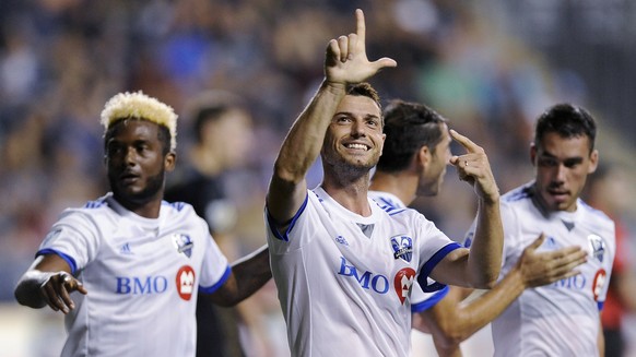 Montreal Impact&#039;s Blerim Dzemaili gestures to the crowd after scoring a goal during the second half of the team&#039;s MLS soccer match against the Philadelphia Union on Saturday, Aug. 12, 2017,  ...